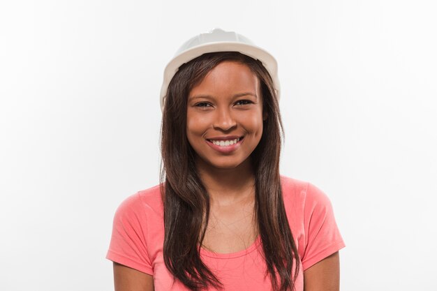 Portrait of a happy teenage girl in white hardhat