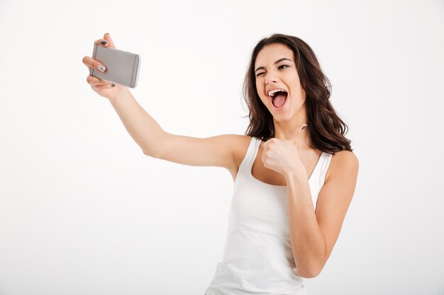 Portrait of a happy woman dressed in tank-top