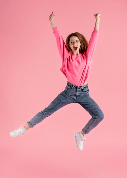 Free Photo portrait happy woman jumping