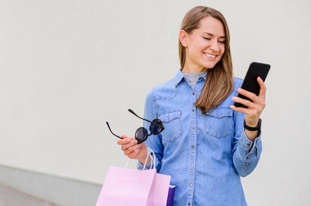 Portrait of happy woman shopping online