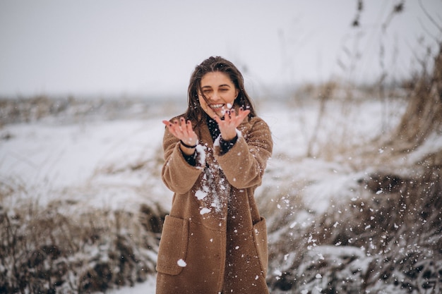 Portrait of a happy woman in winter outside