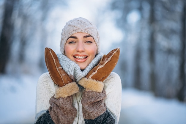 Portrait of happy woman in winter park