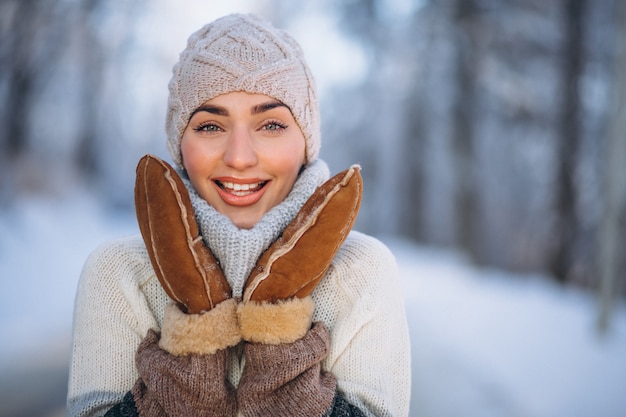 Portrait of happy woman in winter park