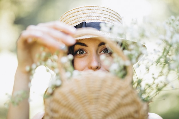 Free Photo portrait of a happy woman with flower basket