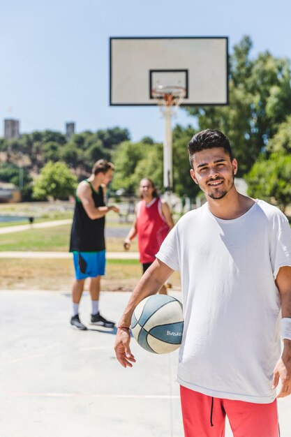 Portrait of happy young basketball player