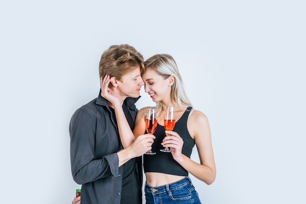 Portrait of happy young couple drinking wine 