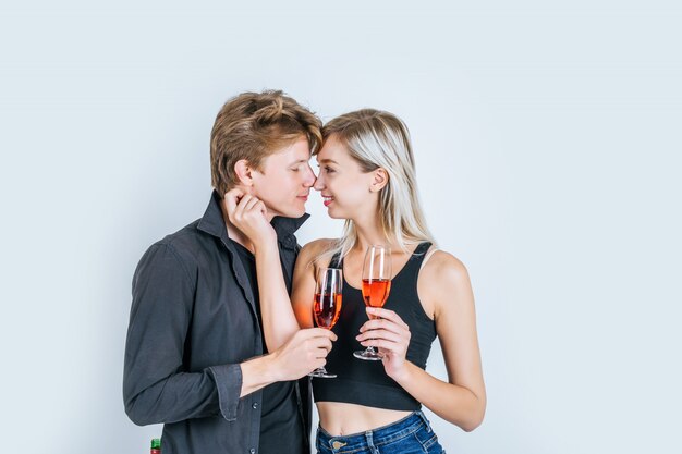 Portrait of happy young couple drinking wine 