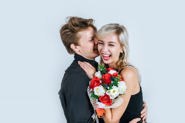 Portrait of happy young couple love together with flower 