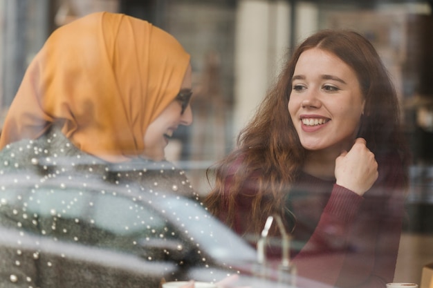 Free photo portrait of happy young friends laughing