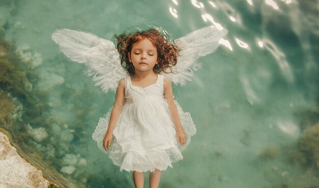 Portrait of human being depicted with angel wings