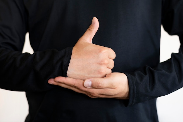 Free photo portrait of interpreter teaching sign language