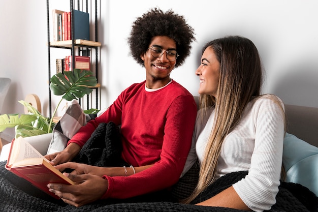 Portrait of interracial couple reading together