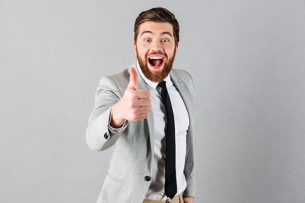 Portrait of a joyful businessman dressed in suit