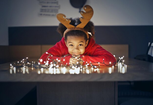 portrait of little black girl at home in Christmas theme