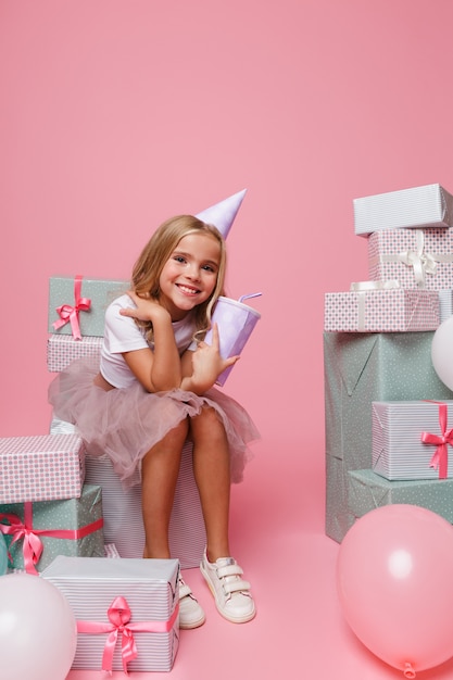 Portrait of a little girl in a birthday hat