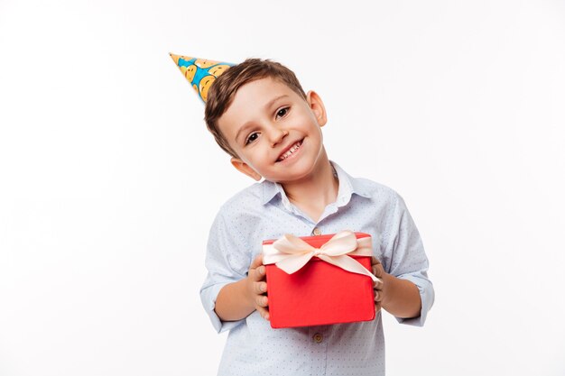 Portrait of a lovely cute little kid in birthday hat