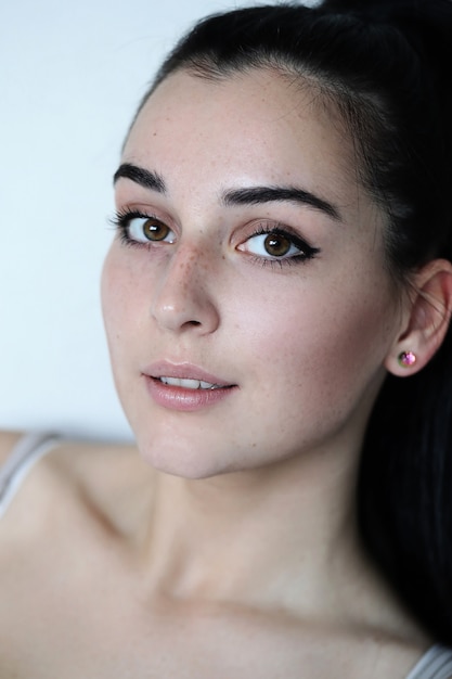 Portrait of lovely young woman posing