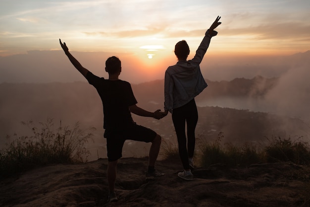 Portrait. lovers cuddle at dawn on the volcano Batur. Bali Indonesia