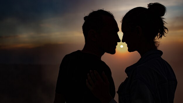 Portrait. lovers cuddle at dawn on the volcano Batur. Bali Indonesia