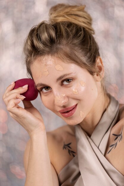 Portrait of makeup artist applying products