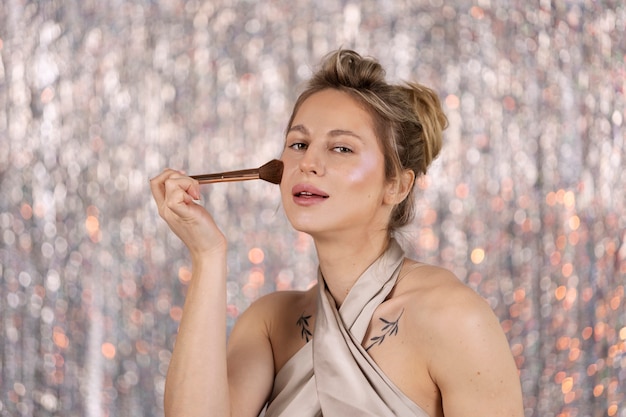 Free Photo portrait of makeup artist applying products