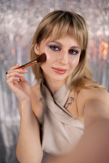 Portrait of makeup artist applying products