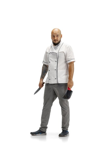 Portrait of a male chef cook, butcher isolated on a white studio.