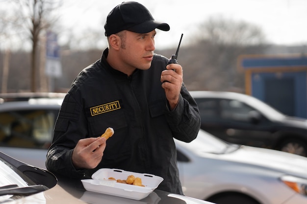 Portrait of male security guard having a lunch break