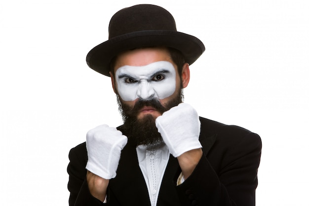 Portrait of a man boxing in makeup mime