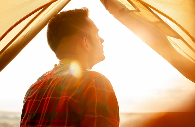 Portrait man in camping tent