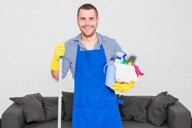 Portrait of man cleaning his home