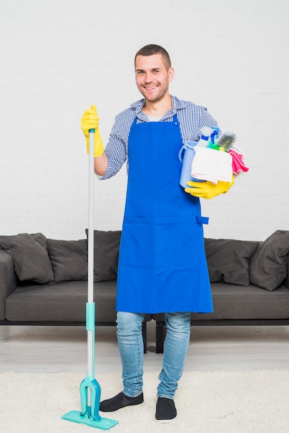 Portrait of man cleaning his home