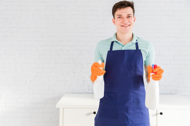 Portrait of man cleaning his house