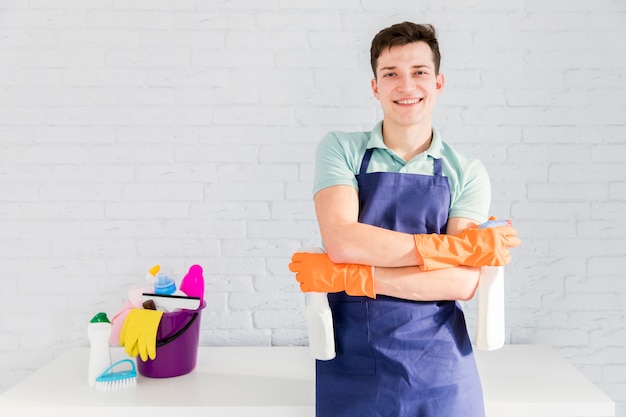 Portrait of man cleaning his house