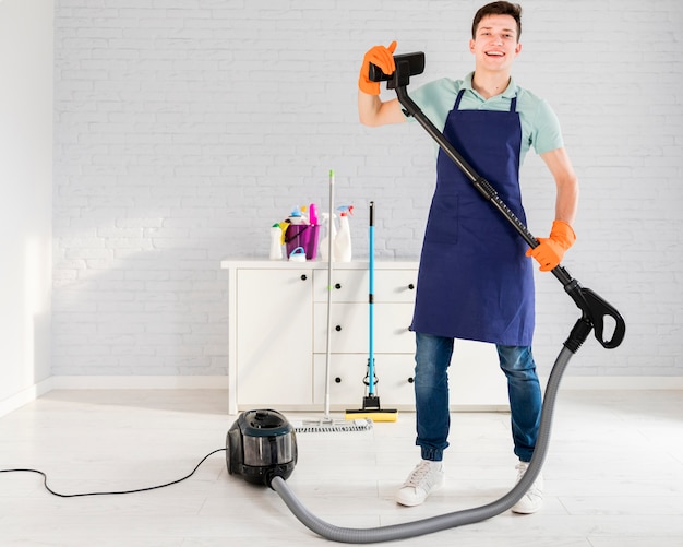 Portrait of man cleaning his house