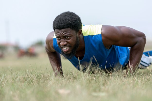 Portrait man doing push ups