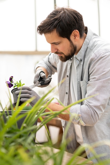 Free photo portrait man growing plants