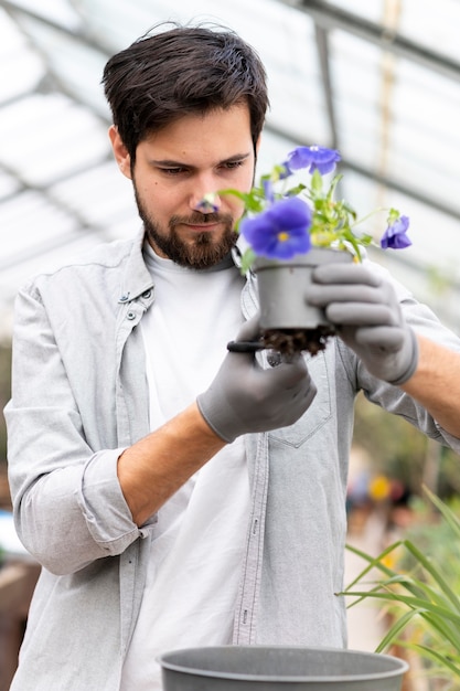 Free photo portrait man growing plants