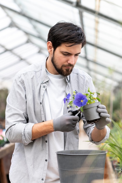 Free photo portrait man growing plants