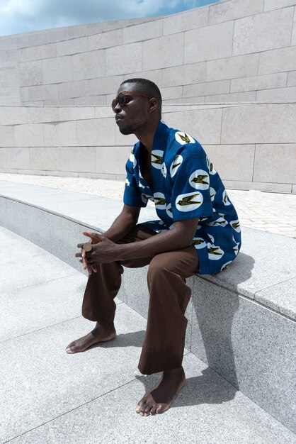 Portrait of man outdoors in traditional african attire