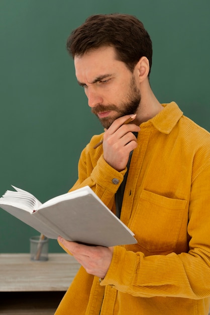 Portrait man reading book