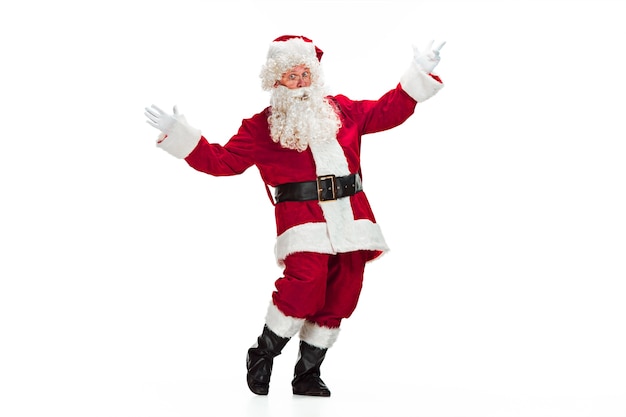 Free Photo portrait of man in santa claus costume with a luxurious white beard, santa's hat and a red costume - in full length isolated on white