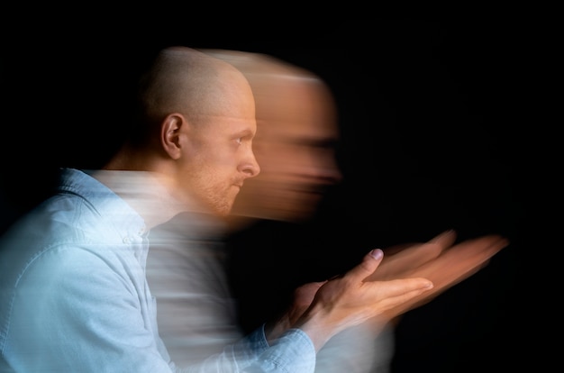 Free photo portrait of man suffering from schizophrenia