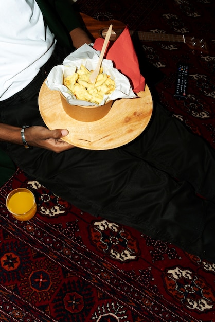 Free photo portrait of man with a delicious dish of poutine