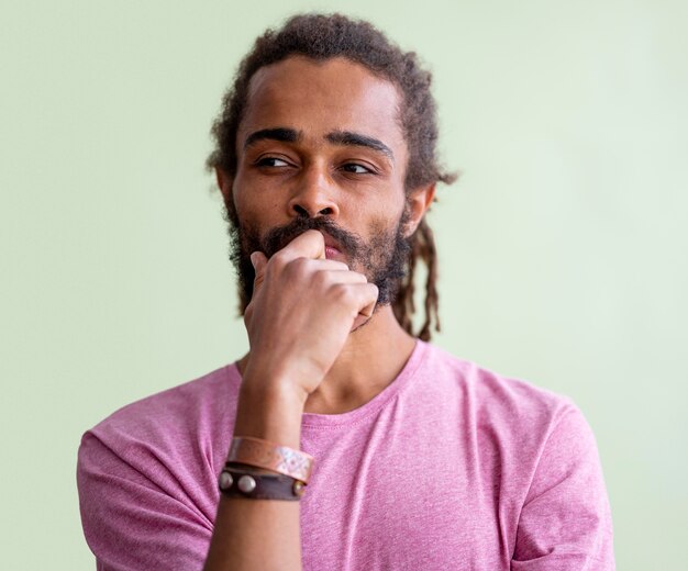 Portrait of man with dreads thinking about something