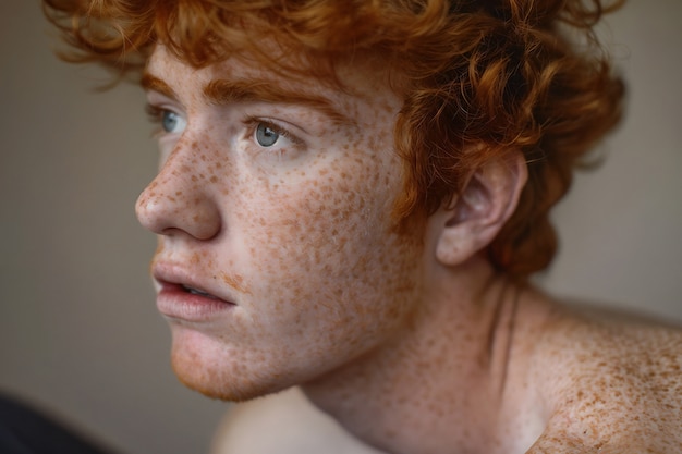 Free Photo portrait of man with freckles and beauty marks