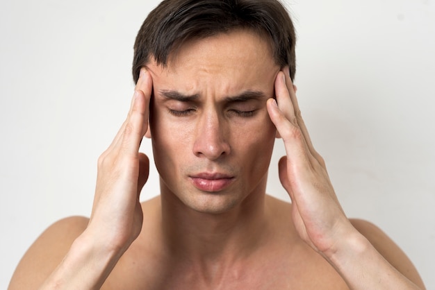 Portrait of a man with headache