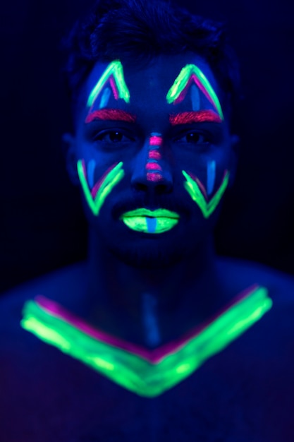 Portrait of man with uv paint