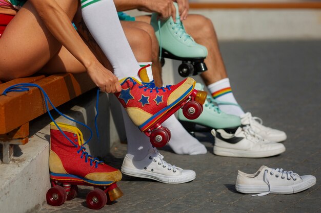 Portrait of man and woman at the beach with roller skates in 80's aesthetic