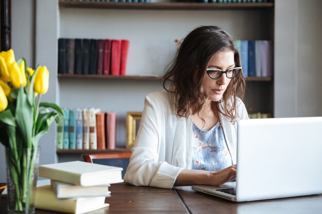 Portrait of a mature business woman working on a laptop